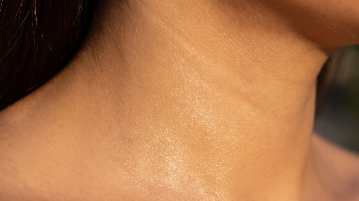 Close-up of hydrated skin showing a smooth, naturally radiant surface.