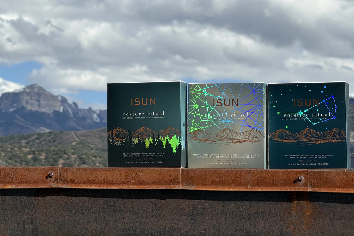 The Winter Solstice Collection boxes on a ledge with the Cimarrons in the background