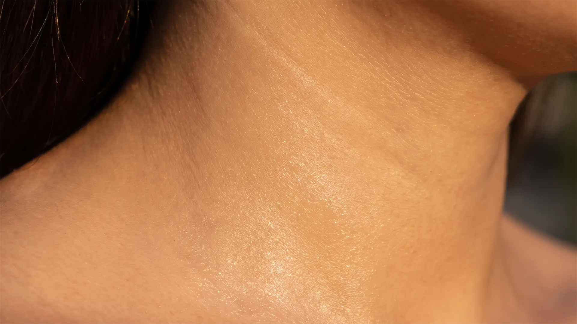 Close-up of hydrated skin showing a smooth, naturally radiant surface.