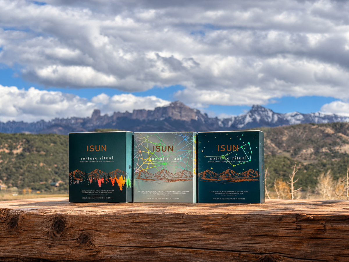 The Winter Solstice Collection boxes on a ledge with the Cimarrons in the background