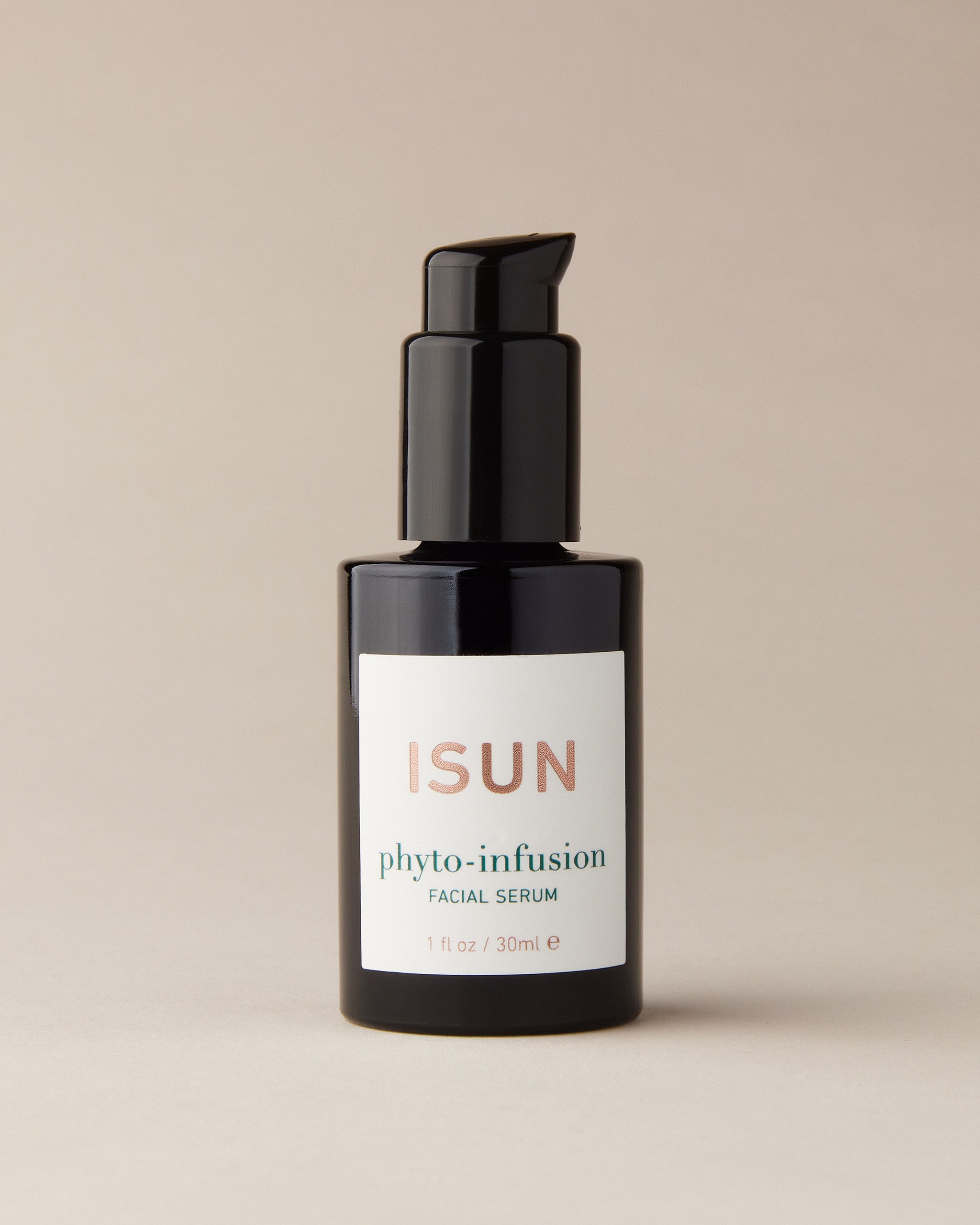 ISUN Phyto-Infusion Serum Bottle on a beige background