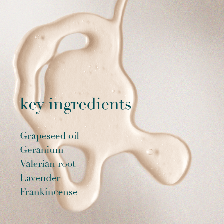 Beige oil with text listing key ingredients on a light background