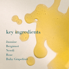Yellow oil splashes with text listing key ingredients on a light background
