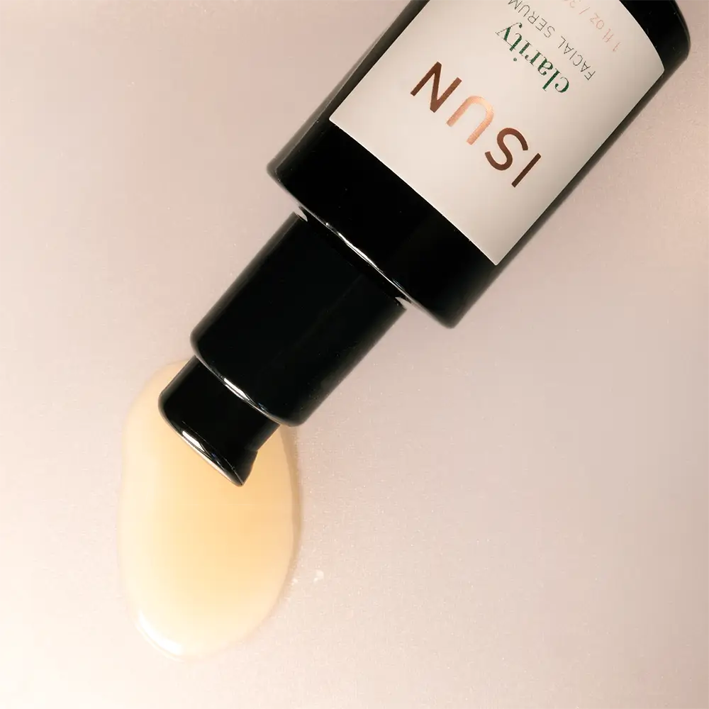 Cosmetic bottle with a label on a light background