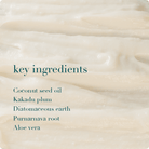 Close-up of a creamy texture with text listing key ingredients.