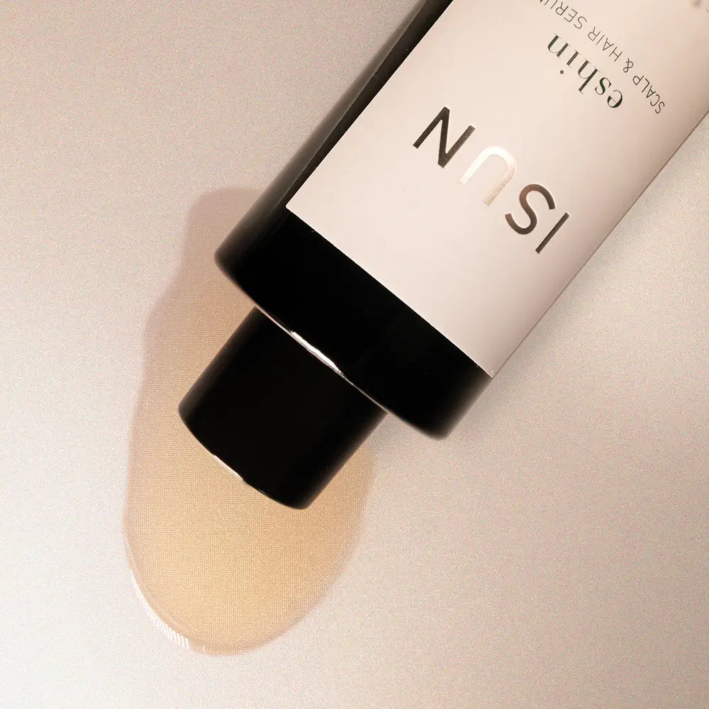 Cosmetic product with ISUN branding on a neutral background