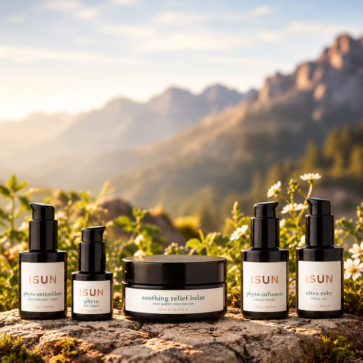 ISUN Dry and Mature Skin Ritual with five skincare products against a sunlit mountain landscape