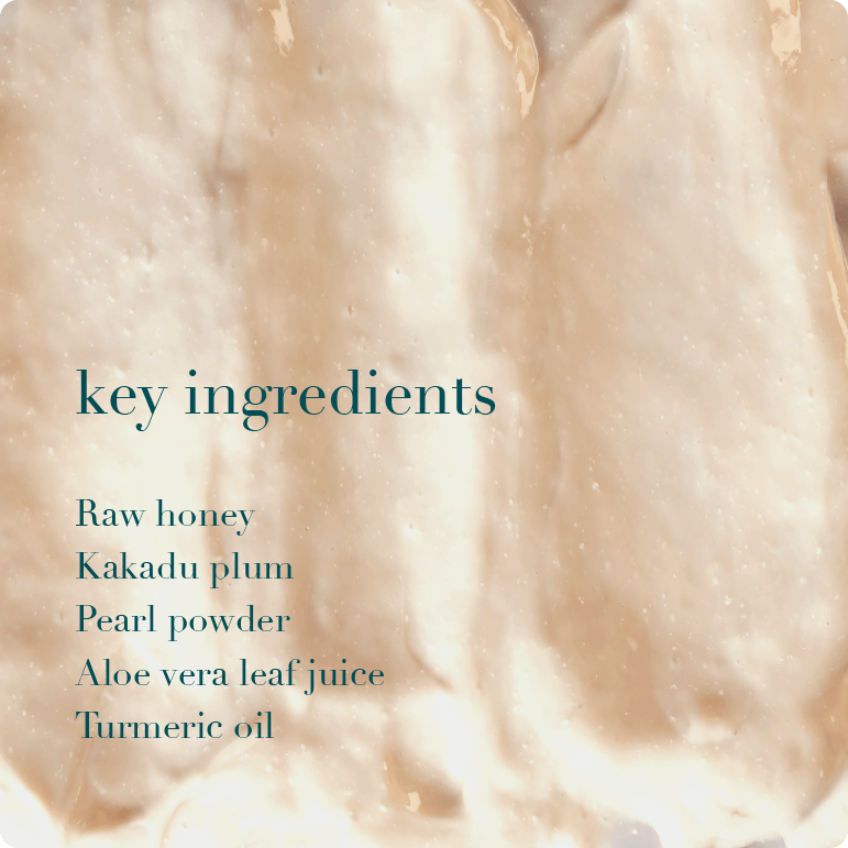 Close-up of a smooth, beige cream with text listing key ingredients.