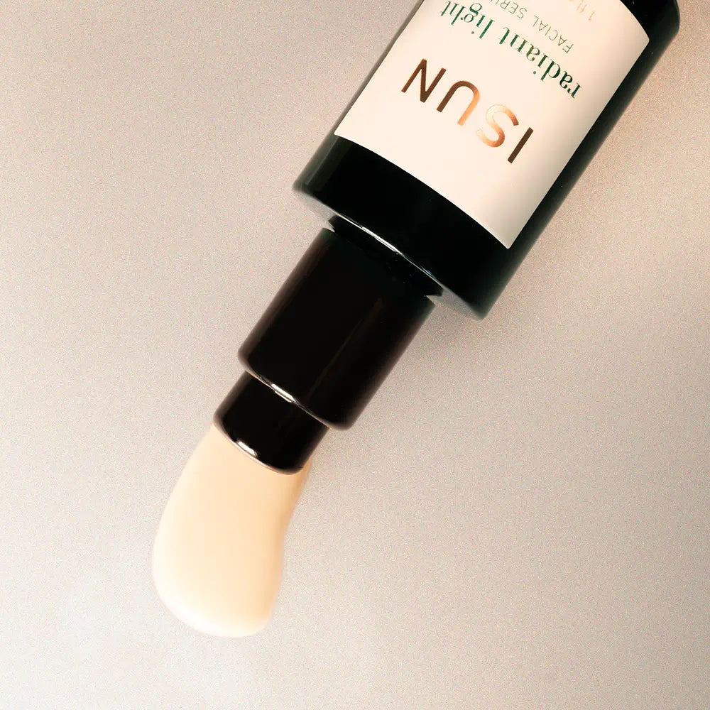 Cosmetic bottle with applicator on a neutral background