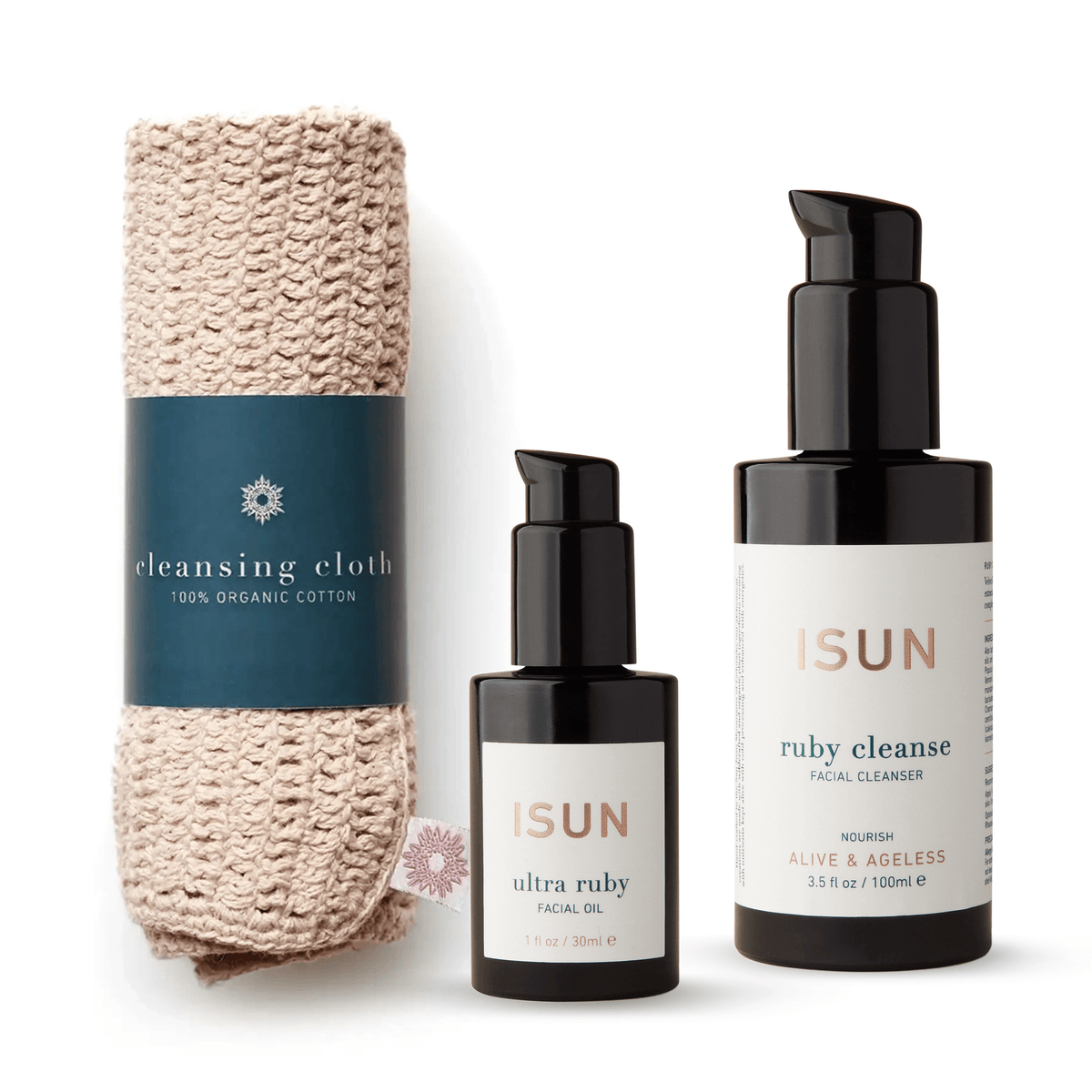 ISUN Restore Ritual with Ruby Cleanse, Ultra Ruby Facial Oil and a rolled cotton face cloth on a white background.