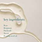 Oil ingredient with text listing key ingredients on a light background
