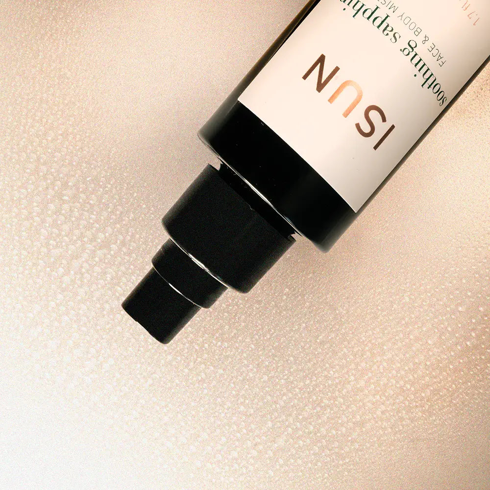 Skincare bottle with 'ISUN' branding on a textured beige background