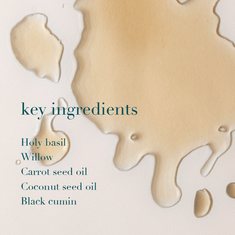 Key ingredients listed with oil droplets on a light background