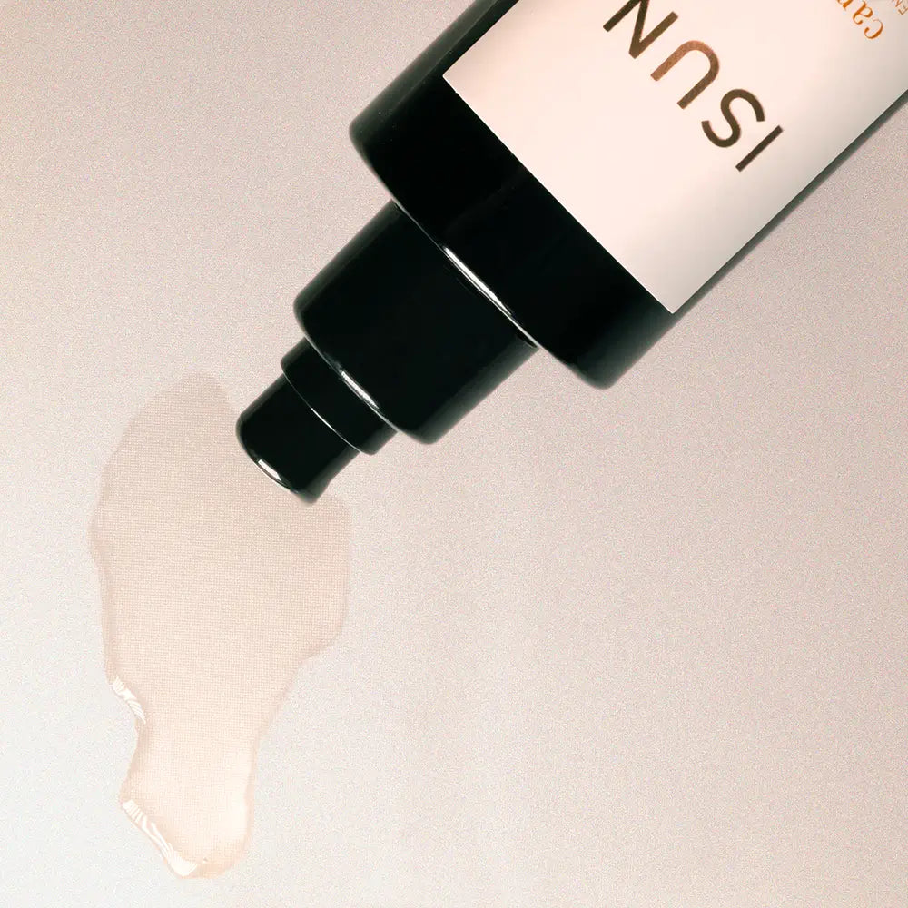 ISUN skincare product with a droplet of oil on a light background