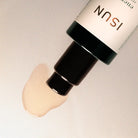 Cosmetic product with visible brand name on a neutral background