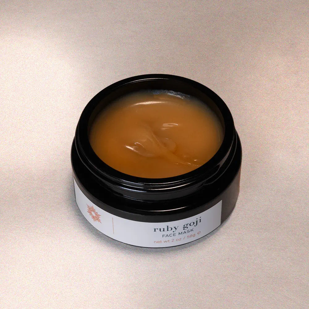 Jar of Ruby Goji face mask on a neutral background